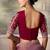 Rose gold metallic faux georgette saree with embroidered wine blouse