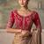 Chiku faux chiffon saree with rich red embroidered blouse