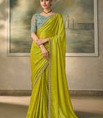 Lime green shimmer faux satin saree with sky blue embroidered blouse