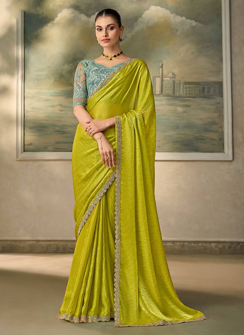 Lime green shimmer faux satin saree with sky blue embroidered blouse
