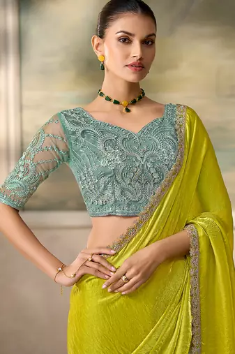 Lime green shimmer faux satin saree with sky blue embroidered blouse