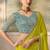 Lime green shimmer faux satin saree with sky blue embroidered blouse