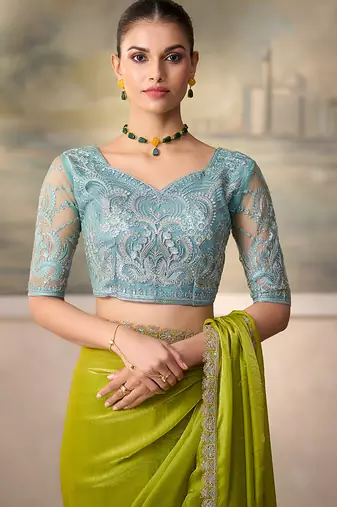 Lime green shimmer faux satin saree with sky blue embroidered blouse