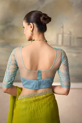 Lime green shimmer faux satin saree with sky blue embroidered blouse
