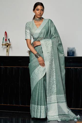Sea green linen blend saree with zari border