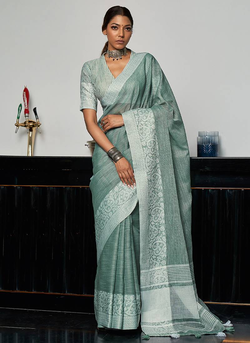 Sea green linen blend saree with zari border