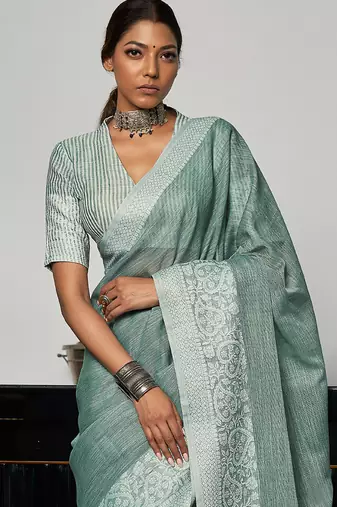 Sea green linen blend saree with zari border