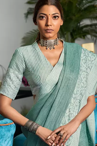 Sea green linen blend saree with zari border