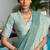 Sea green linen blend saree with zari border