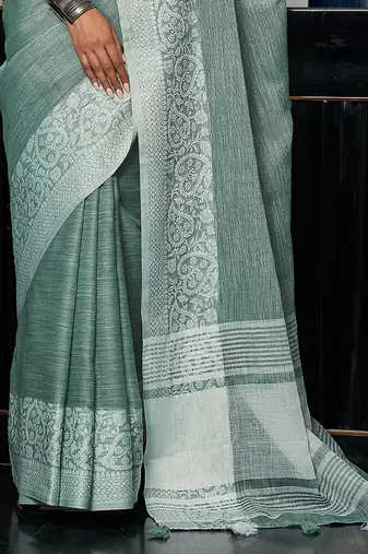 Sea green linen blend saree with zari border