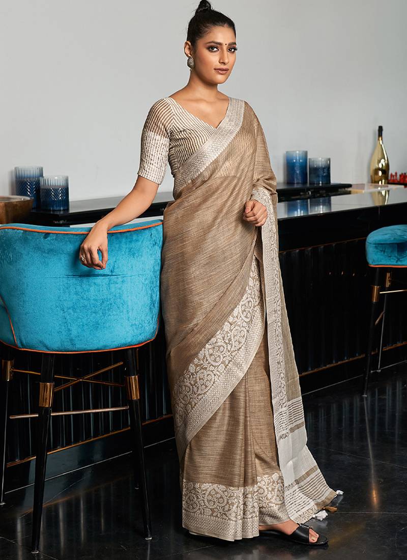 Beige linen blend saree with zari border