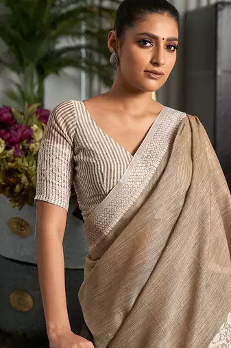 Beige linen blend saree with zari border