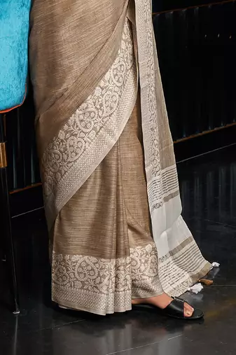 Beige linen blend saree with zari border