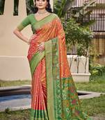 Orange silk blend saree with contrast woven zari border