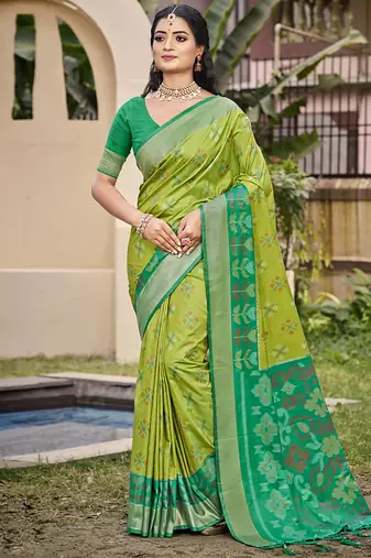 Light green silk blend saree with contrast woven zari border