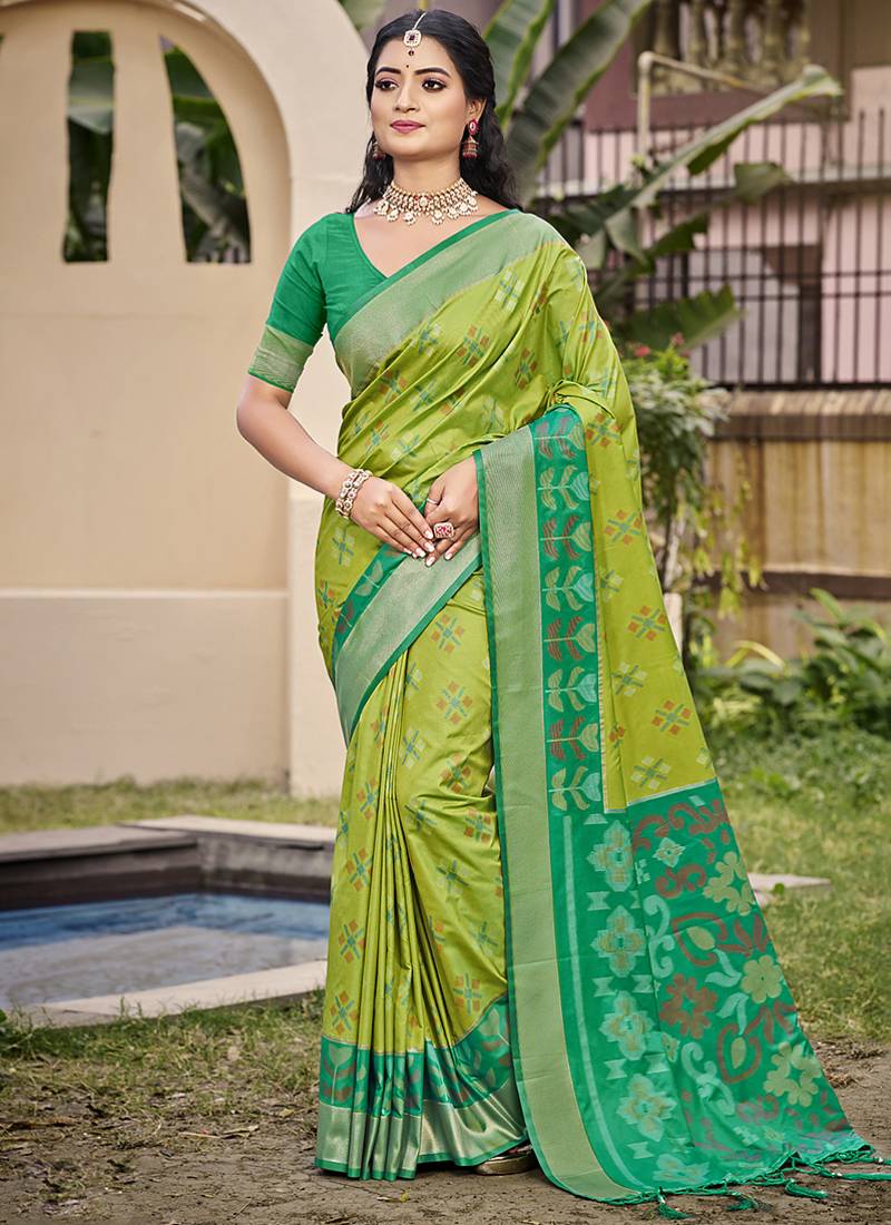 Light green silk blend saree with contrast woven zari border