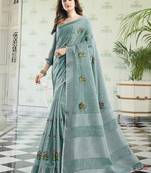 Sea green handloom linen blend saree with floral embroidery