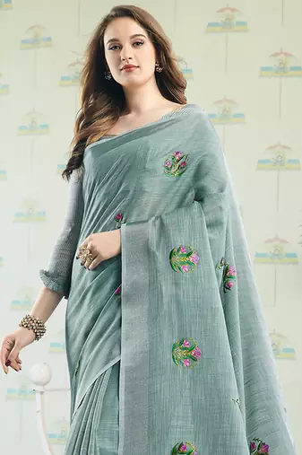 Sea green handloom linen blend saree with floral embroidery