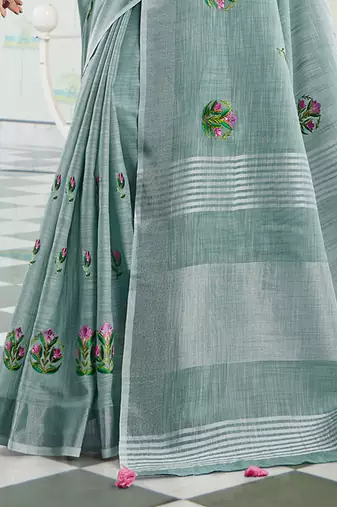 Sea green handloom linen blend saree with floral embroidery