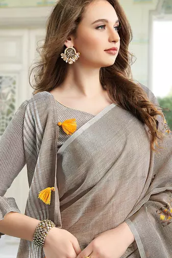 Light beige handloom linen blend saree with floral embroidery