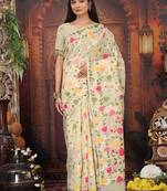 cream cotton blend saree with colorful woven floral motifs