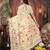 cream cotton blend saree with colorful woven floral motifs