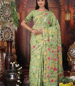 light green cotton blend saree with colorful woven floral motifs