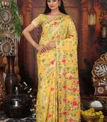 yellow cotton blend saree with colorful woven floral motifs