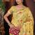 yellow cotton blend saree with colorful woven floral motifs