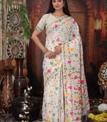 white cotton blend saree with colorful woven floral motifs