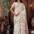 white cotton blend saree with colorful woven floral motifs