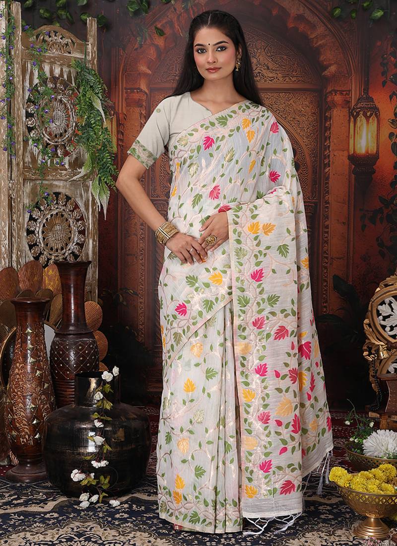 white cotton blend saree with colorful woven floral motifs