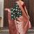 Bottle green silk blend woven saree with paisley motifs