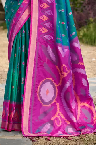 teal pochampally silk blend saree with contrast border