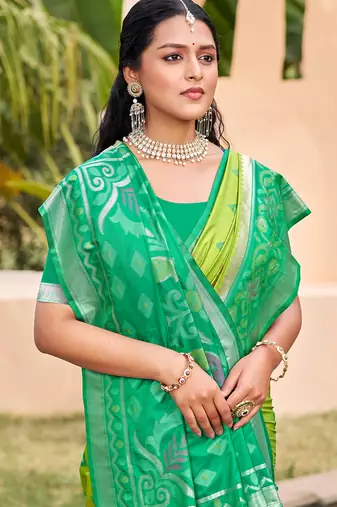 Light green silk blend woven saree with contrast pallu and border