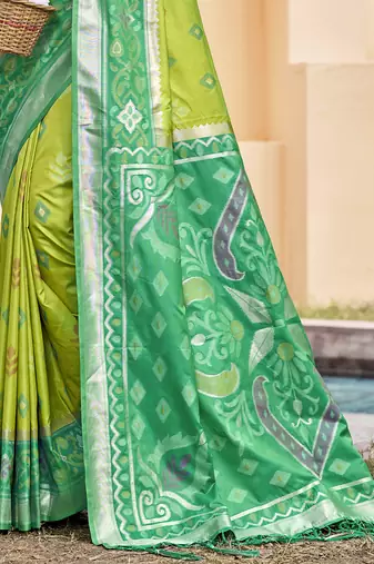 Light green silk blend woven saree with contrast pallu and border