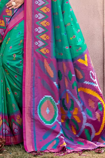 turquoise pochampally silk blend saree with contrast geometric pallu and border