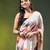 Beige chinon silk saree with vibrant floral print