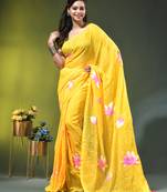 yellow mulmul cotton blend saree with lotus bloom print