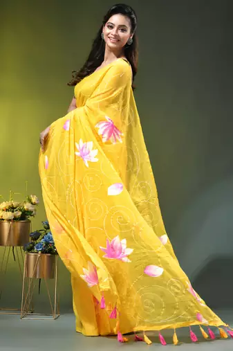 yellow mulmul cotton blend saree with lotus bloom print