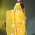 yellow mulmul cotton blend saree with lotus bloom print