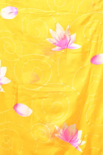 yellow mulmul cotton blend saree with lotus bloom print