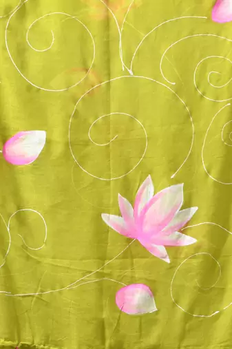 lime green mulmul cotton blend saree with lotus bloom print