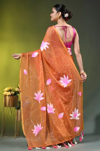 orange mulmul cotton blend saree with lotus bloom print