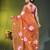 orange mulmul cotton blend saree with lotus bloom print