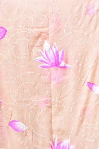 beige mulmul cotton blend saree with lotus bloom print