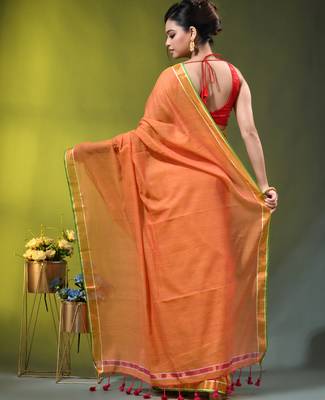 orange solid mulmul cotton blend saree with contrast border 4
