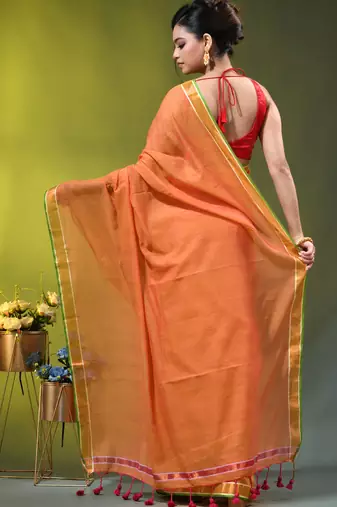 orange solid mulmul cotton blend saree with contrast border