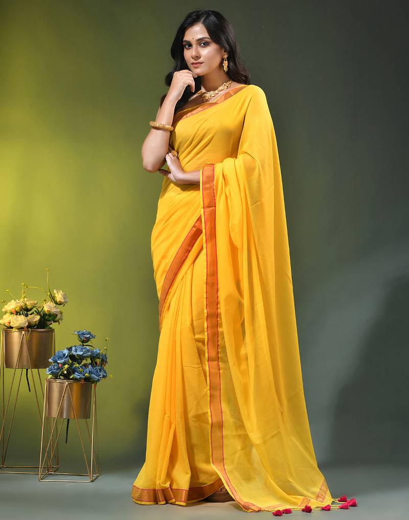 yellow solid mulmul cotton blend saree with contrast border