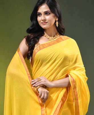 yellow solid mulmul cotton blend saree with contrast border 2